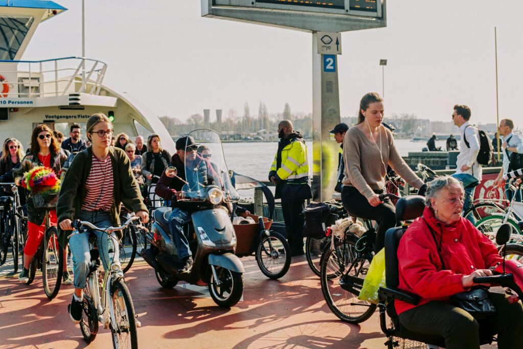 Cyclists disembarking from a ferry, ready to explore their destination on two wheels, emphasizing the seamless integration of cycling and ferry transport.
